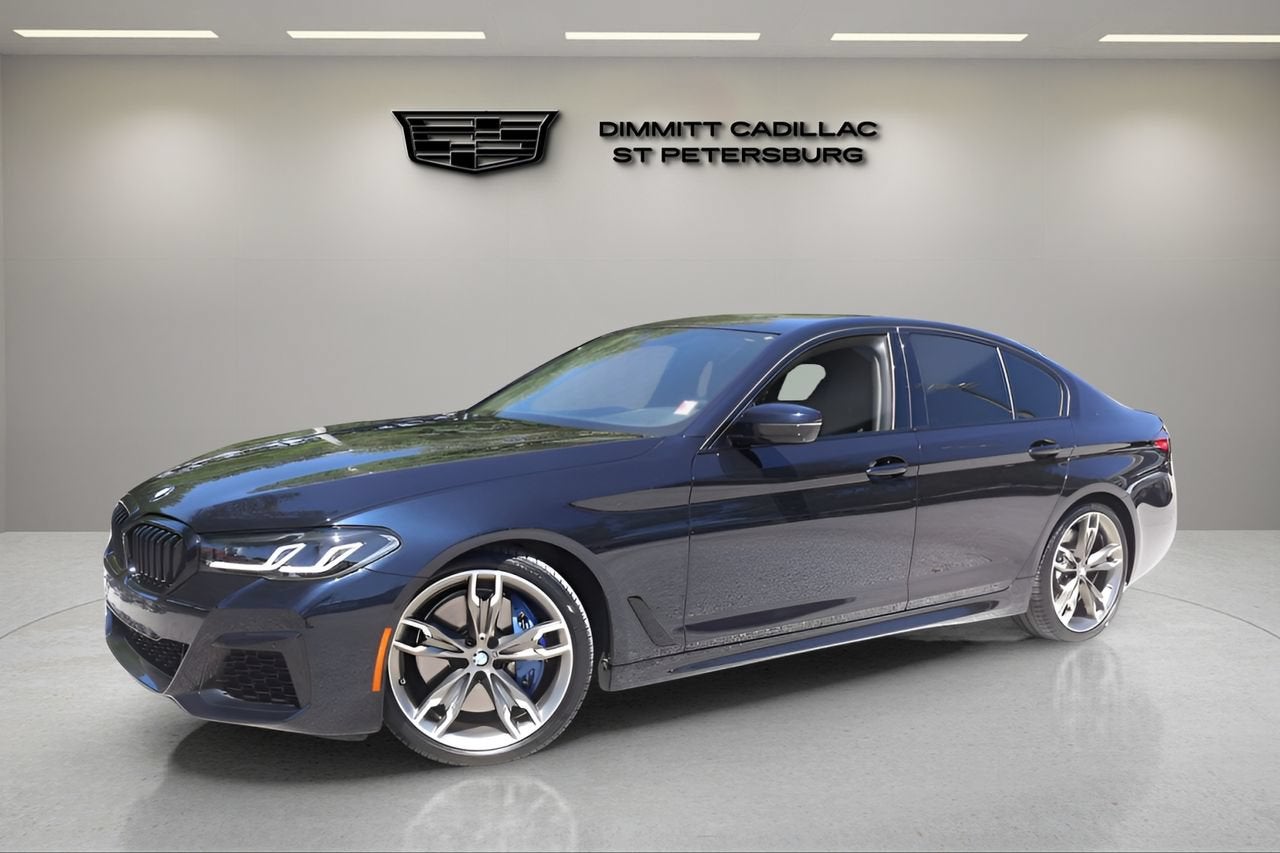 2022 BMW 5 Series M550i xDrive in Blue — front three-quarter view