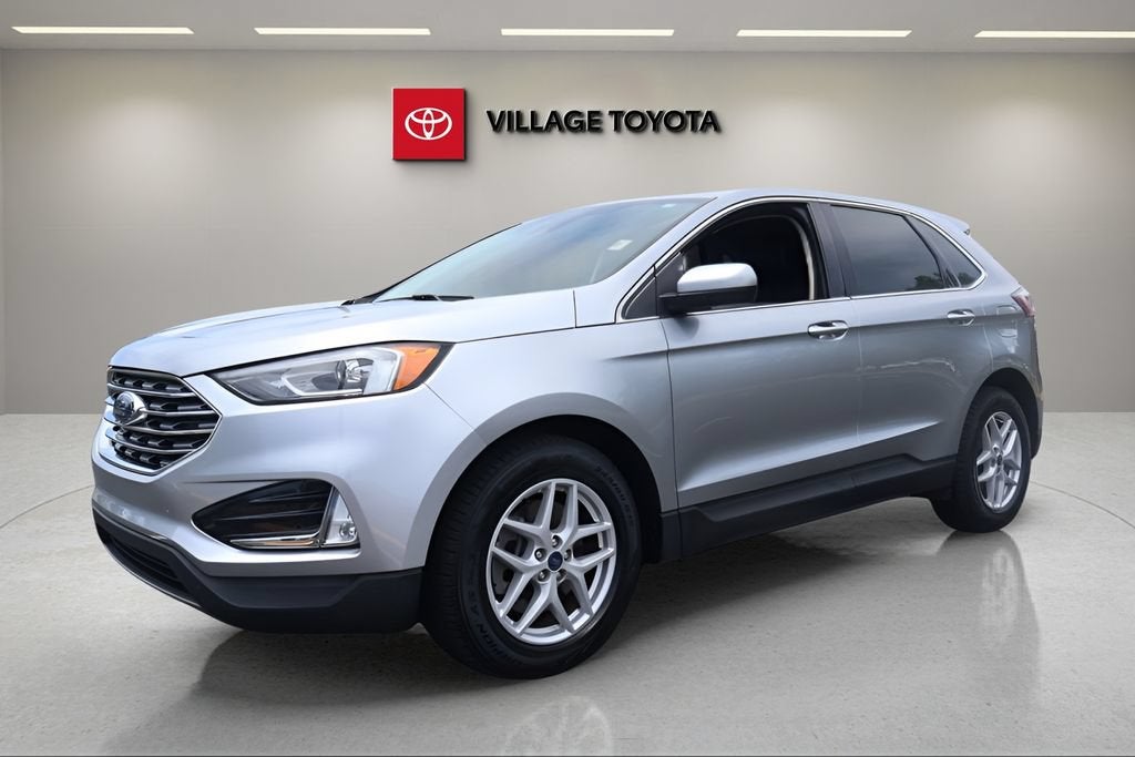 2021 Ford Edge SEL in Iconic Silver Metallic — front three-quarter view