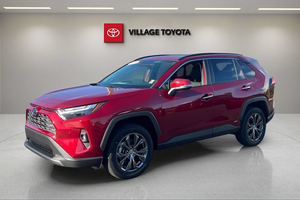 2024 Toyota RAV4 Hybrid Limited in Ruby Flare Pearl — front three-quarter view