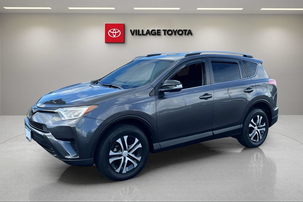 2018 Toyota RAV4 LE in Magnetic Gray Metallic — front three-quarter view